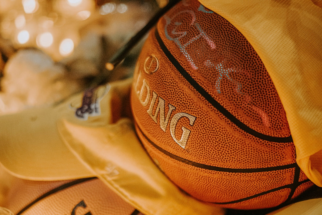brown and black basketball on brown leather textile